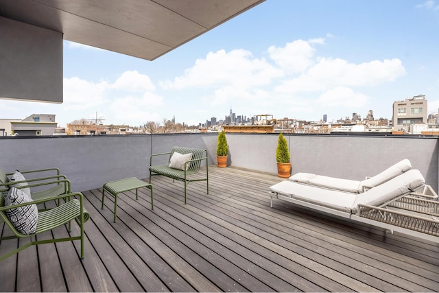 wooden deck with a skyline view