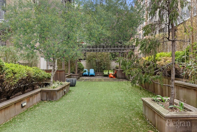 view of yard with a pergola and fence