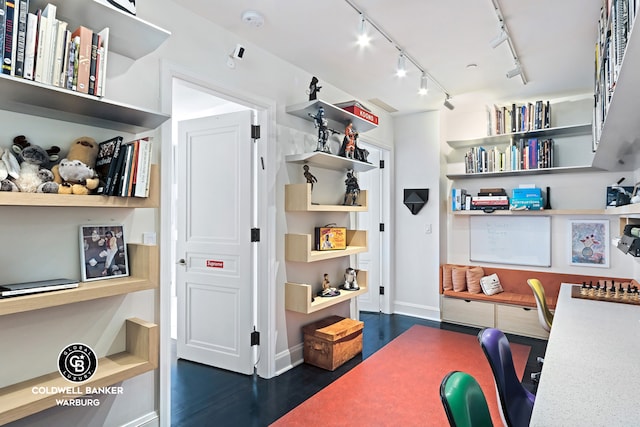 170 E End Ave Unit 8/9E, New York City, NY 10128 - office with rail lighting, dark wood-style floors, and baseboards