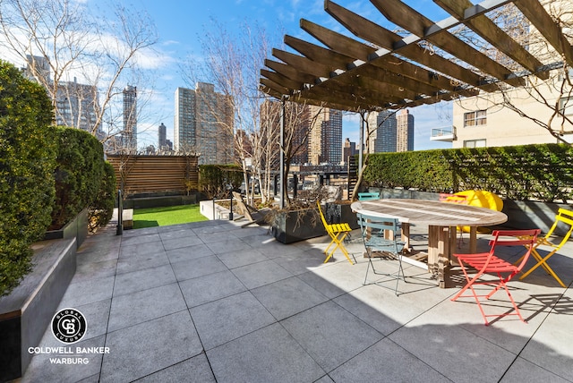 170 E End Ave Unit 8/9E, New York City, NY 10128 - view of patio with a view of skyline, a pergola, fence, and outdoor dining space