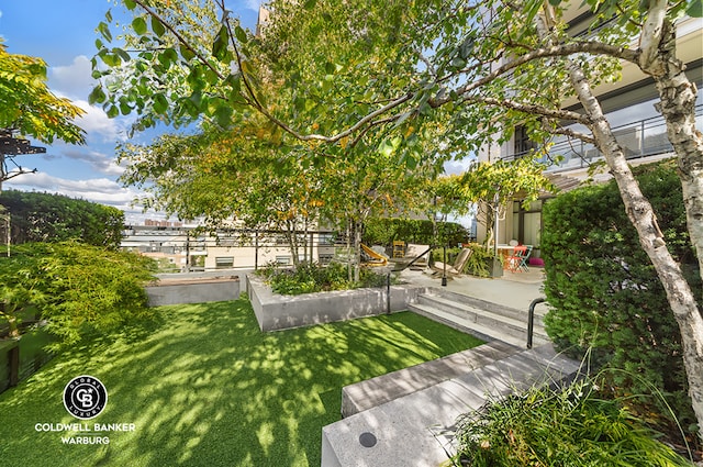 170 E End Ave Unit 8/9E, New York City, NY 10128 - view of grassy yard featuring a patio