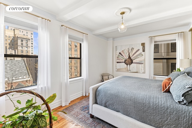 220 W 93rd St Unit 6A, New York City, NY 10025 - bedroom with beam ceiling and wood finished floors