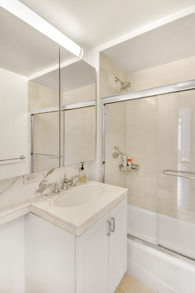 205 E 85th St Unit 7-B, New York City, NY 10028 - bathroom with vanity and shower / bath combination with glass door