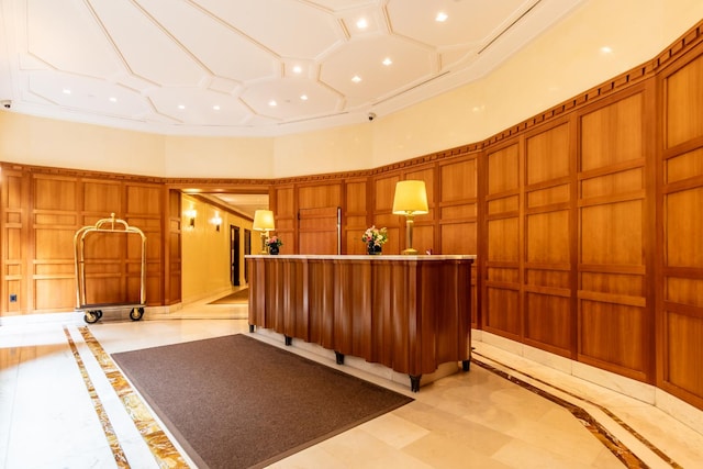 205 E 85th St Unit 7-B, New York City, NY 10028 - welcome area with a decorative wall, a high ceiling, recessed lighting, and wooden walls