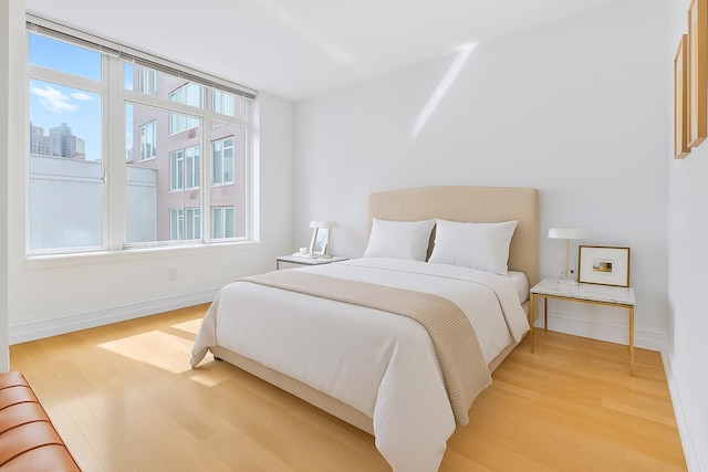 205 E 85th St Unit 7-B, New York City, NY 10028 - bedroom featuring light wood-style flooring and baseboards