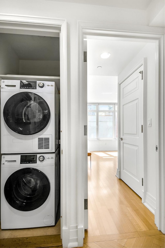 205 E 85th St Unit 7-B, New York City, NY 10028 - laundry area with estacked washer and dryer and light wood-type flooring