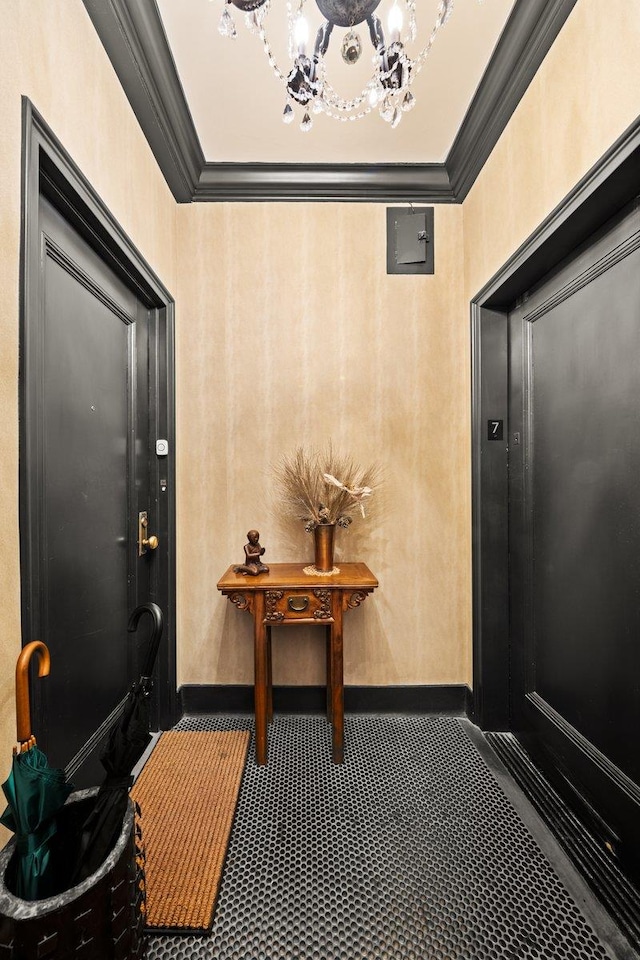 55 Park Ave Unit 7-W, New York City, NY 10016 - foyer with crown molding, a chandelier, and baseboards