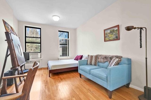 7 2nd Ave Unit 2-B, New York City, NY 10003 - bedroom featuring light wood-style flooring, cooling unit, and lofted ceiling
