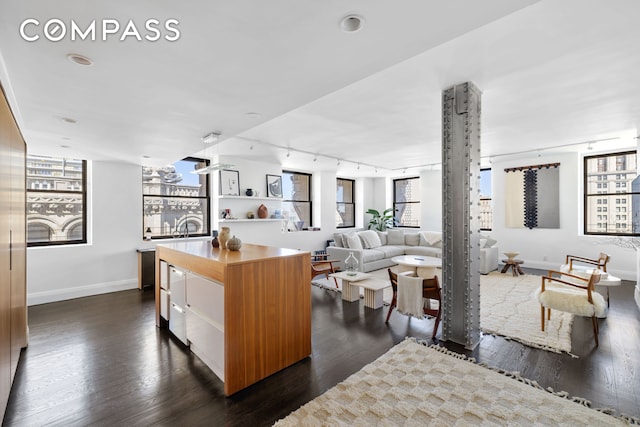 150 Nassau St Unit 18Ab, New York City, NY 10038 - kitchen featuring baseboards, dark wood-style flooring, and a kitchen island