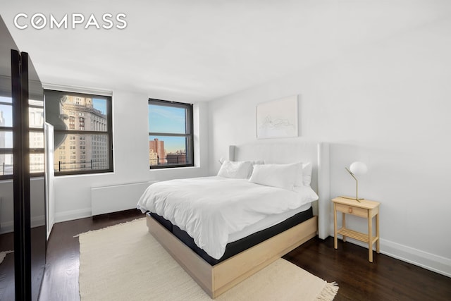 150 Nassau St Unit 18Ab, New York City, NY 10038 - bedroom featuring baseboards and wood finished floors