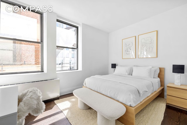 150 Nassau St Unit 18Ab, New York City, NY 10038 - bedroom featuring baseboards and dark wood-style floors