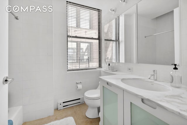 150 Nassau St Unit 18Ab, New York City, NY 10038 - full bath with baseboard heating, tile patterned flooring, vanity, toilet, and tile walls