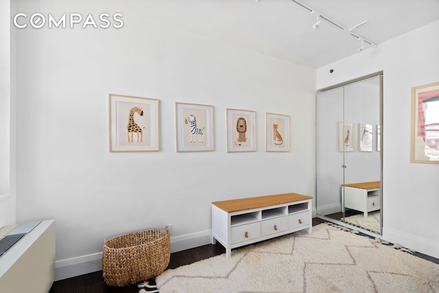 150 Nassau St Unit 18Ab, New York City, NY 10038 - interior space with track lighting, baseboards, and wood finished floors