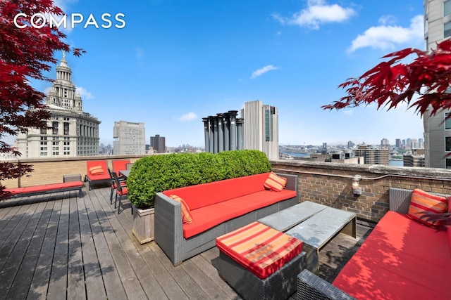 150 Nassau St Unit 18Ab, New York City, NY 10038 - wooden deck featuring a city view and an outdoor hangout area
