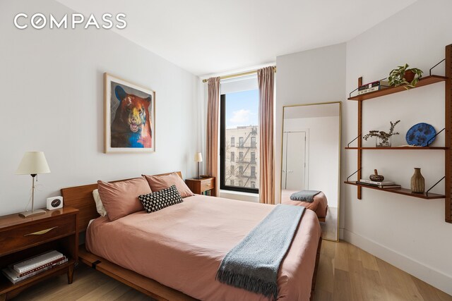 111 Montgomery St Unit 7M, New York City, NY 11225 - bedroom with light wood-style floors and baseboards