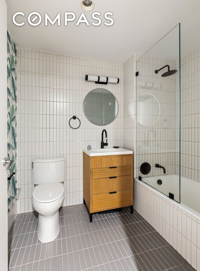 111 Montgomery St Unit 7M, New York City, NY 11225 - bathroom with tile patterned flooring, tile walls, tiled shower / bath combo, and vanity