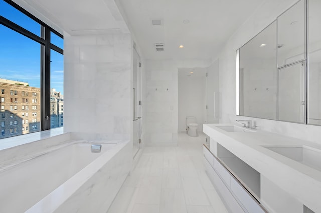 full bathroom with visible vents, toilet, a bath, a shower stall, and a sink