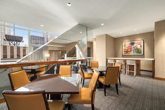 dining space featuring carpet flooring, healthy amount of natural light, and recessed lighting