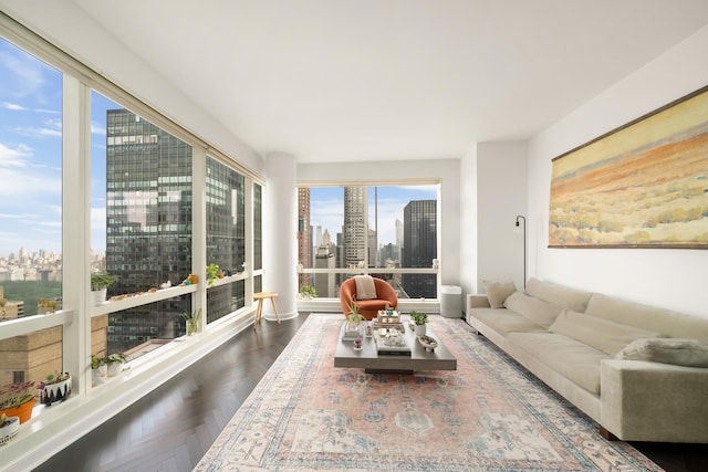 sunroom / solarium featuring a view of skyline