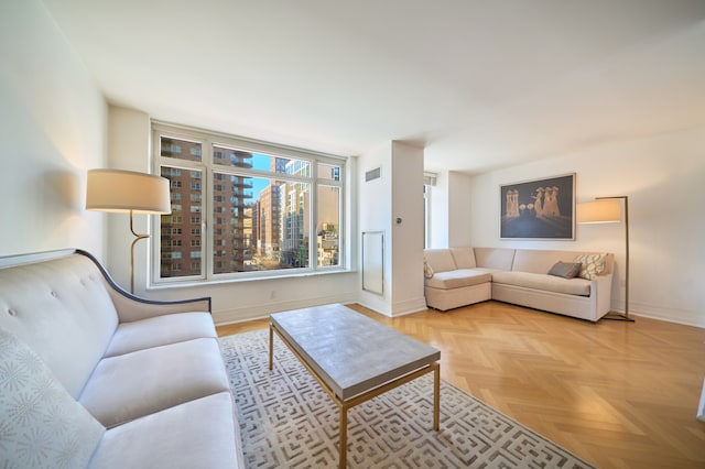 205 E 85th St Unit 8K, New York City, NY 10028 - living room featuring baseboards