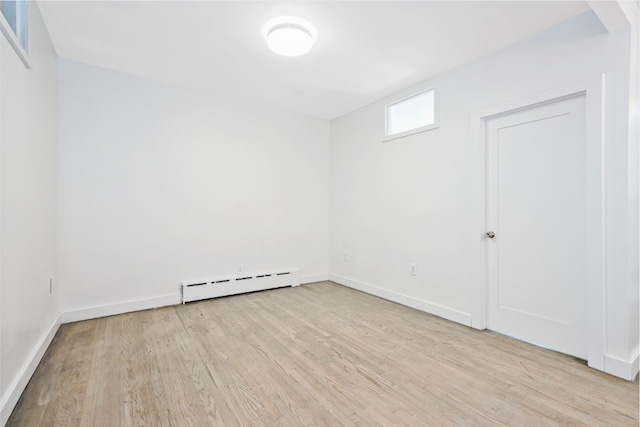 309 Covert St, New York City, NY 11237 - unfurnished room with baseboard heating, wood finished floors, and baseboards