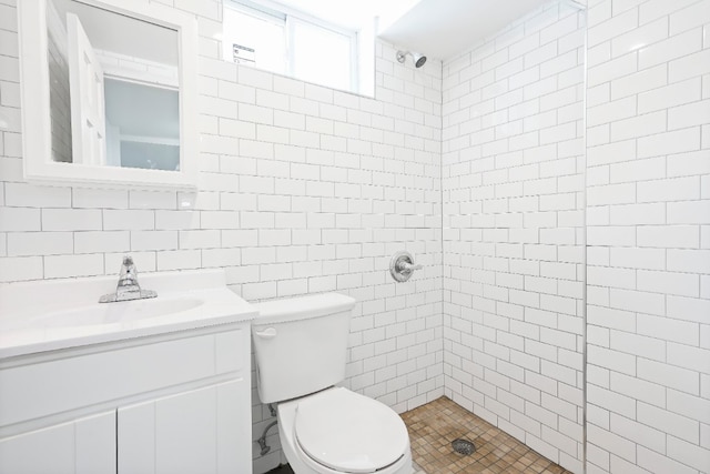 309 Covert St, New York City, NY 11237 - bathroom featuring tiled shower, tile walls, vanity, and toilet