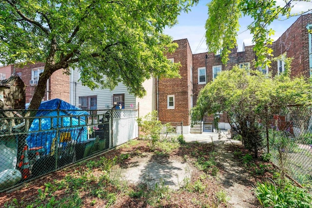 309 Covert St, New York City, NY 11237 - rear view of property featuring brick siding