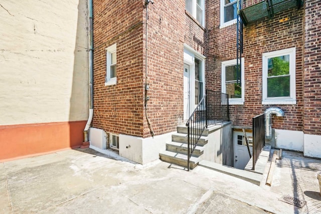 309 Covert St, New York City, NY 11237 - property entrance featuring brick siding