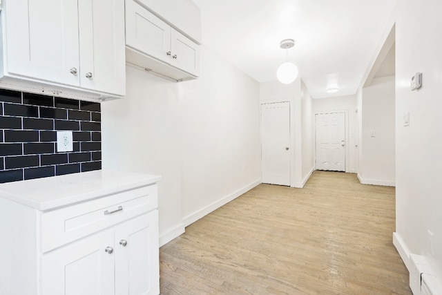309 Covert St, New York City, NY 11237 - hallway featuring light wood finished floors and baseboards