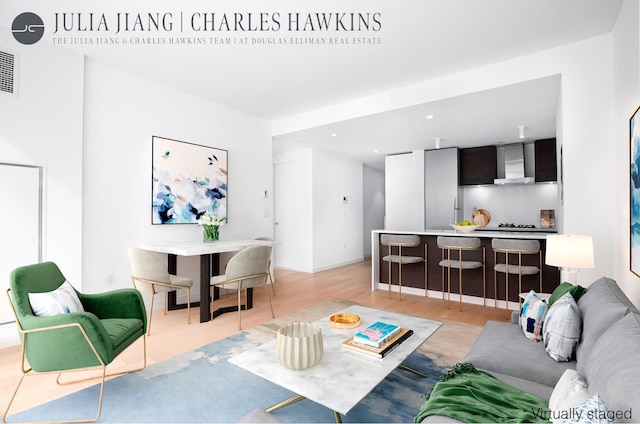 540 W 49th St Unit 307S, New York City, NY 10019 - living area with light wood-type flooring and recessed lighting