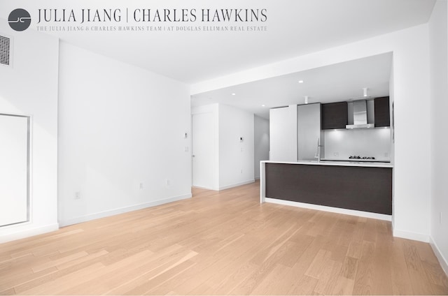 540 W 49th St Unit 307S, New York City, NY 10019 - unfurnished living room with light wood finished floors and recessed lighting