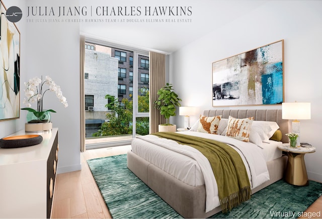 540 W 49th St Unit 307S, New York City, NY 10019 - bedroom featuring wood finished floors and floor to ceiling windows