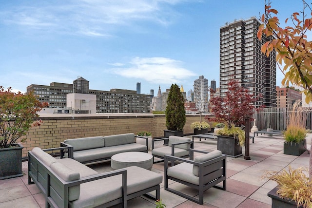 view of patio / terrace with a city view and outdoor lounge area