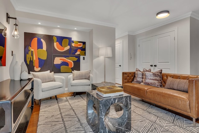 living area featuring wood finished floors, crown molding, and recessed lighting