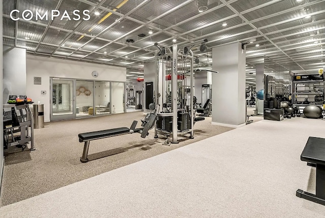 gym with carpet floors and baseboards