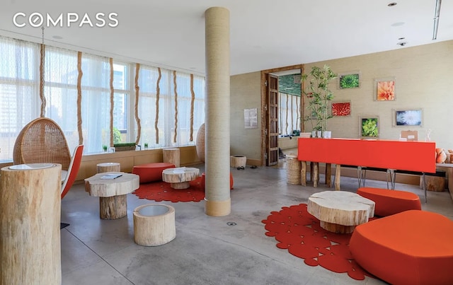 200 E 66th St Unit A407, New York City, NY 10065 - living area featuring concrete floors and plenty of natural light