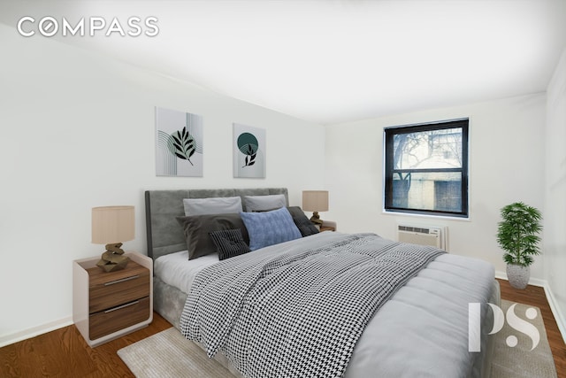 bedroom featuring baseboards, wood finished floors, and a wall mounted AC