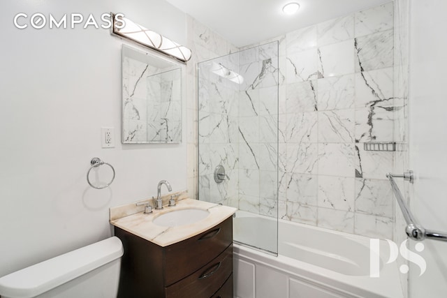 bathroom with toilet, vanity, and tub / shower combination