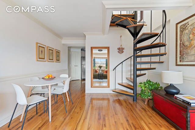 1139 Prospect Ave Unit 4G, New York City, NY 11218 - dining space featuring stairs, hardwood / wood-style floors, crown molding, and wainscoting