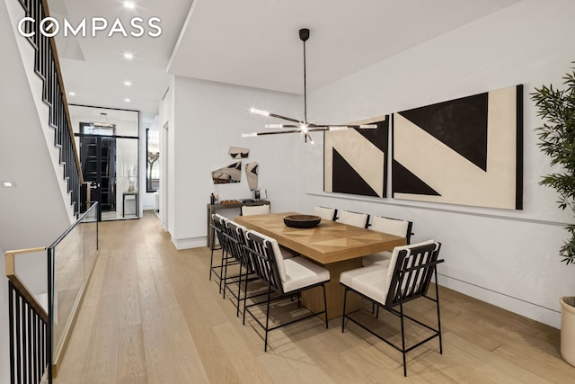 54 E 80th St, New York City, NY 10075 - dining room featuring light wood-style floors, stairs, baseboards, and recessed lighting