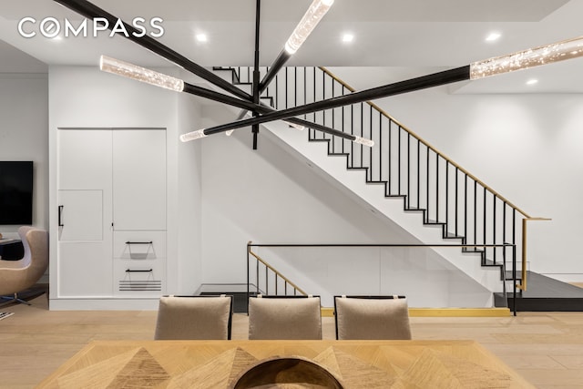 54 E 80th St, New York City, NY 10075 - stairs featuring wood finished floors, recessed lighting, and baseboards