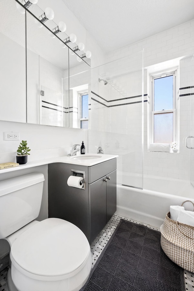 full bathroom with toilet,  shower combination, and vanity