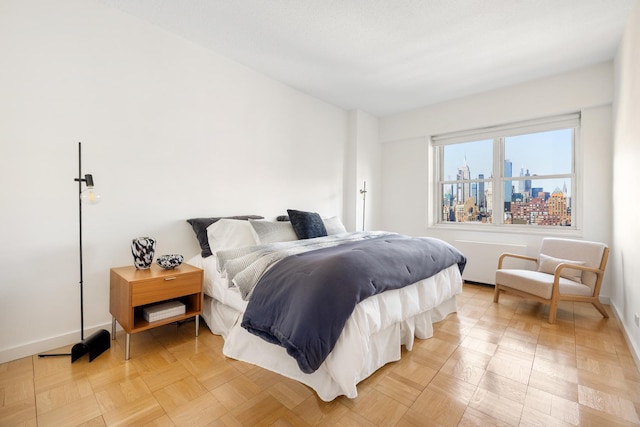 bedroom with a view of city