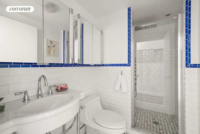 181 7th Ave Unit 14A, New York City, NY 10011 - full bath featuring tile walls, a shower stall, and vanity