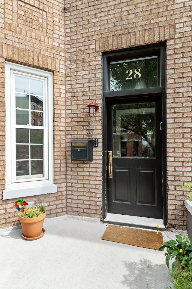 entrance to property with brick siding