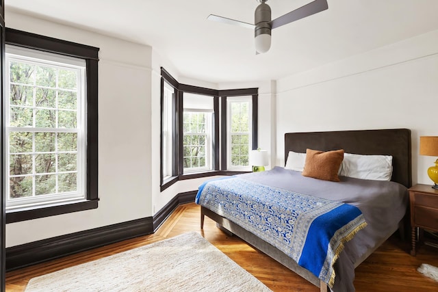 bedroom with ceiling fan and wood finished floors