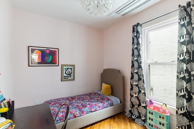 bedroom featuring wood finished floors