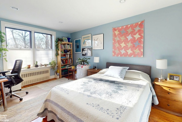 2244 Bronx Park E Unit 1B, New York City, NY 10467 - bedroom featuring radiator, a desk, wood finished floors, and recessed lighting