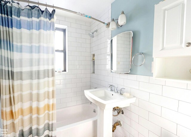 2244 Bronx Park E Unit 1B, New York City, NY 10467 - bathroom with shower / bathtub combination with curtain and backsplash