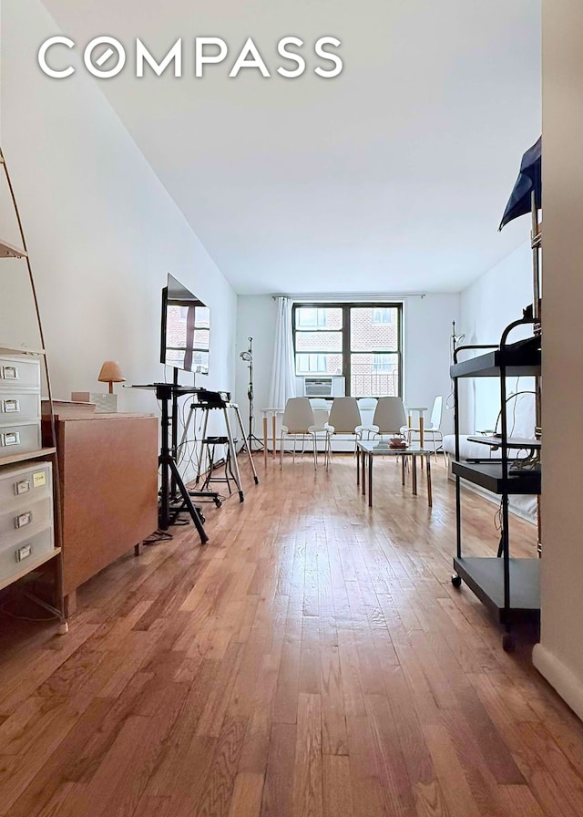 229 E 29th St Unit 5H, New York City, NY 10016 - interior space featuring wood-type flooring and a baseboard heating unit